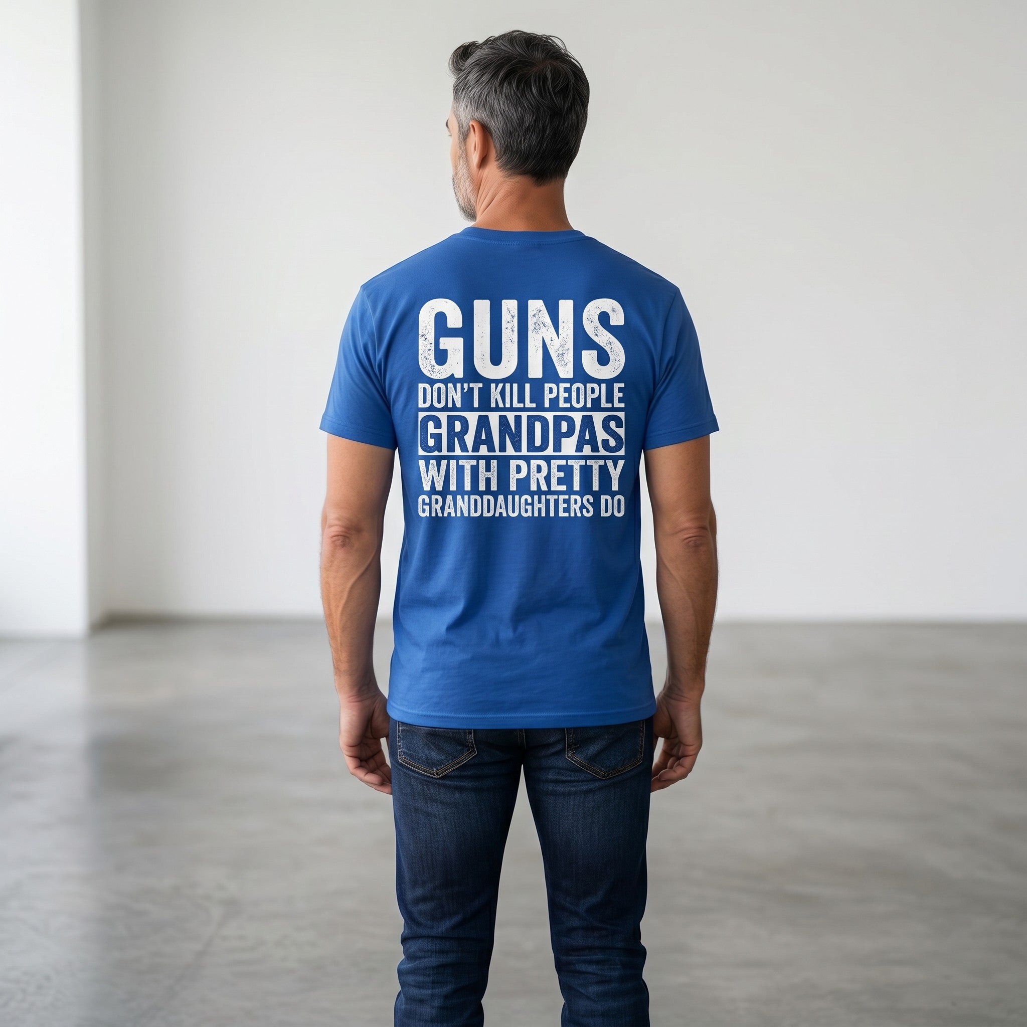 TrendyShift.Com blue heavy cotton t-shirt with white distressed text print on back worn by a man in jeans