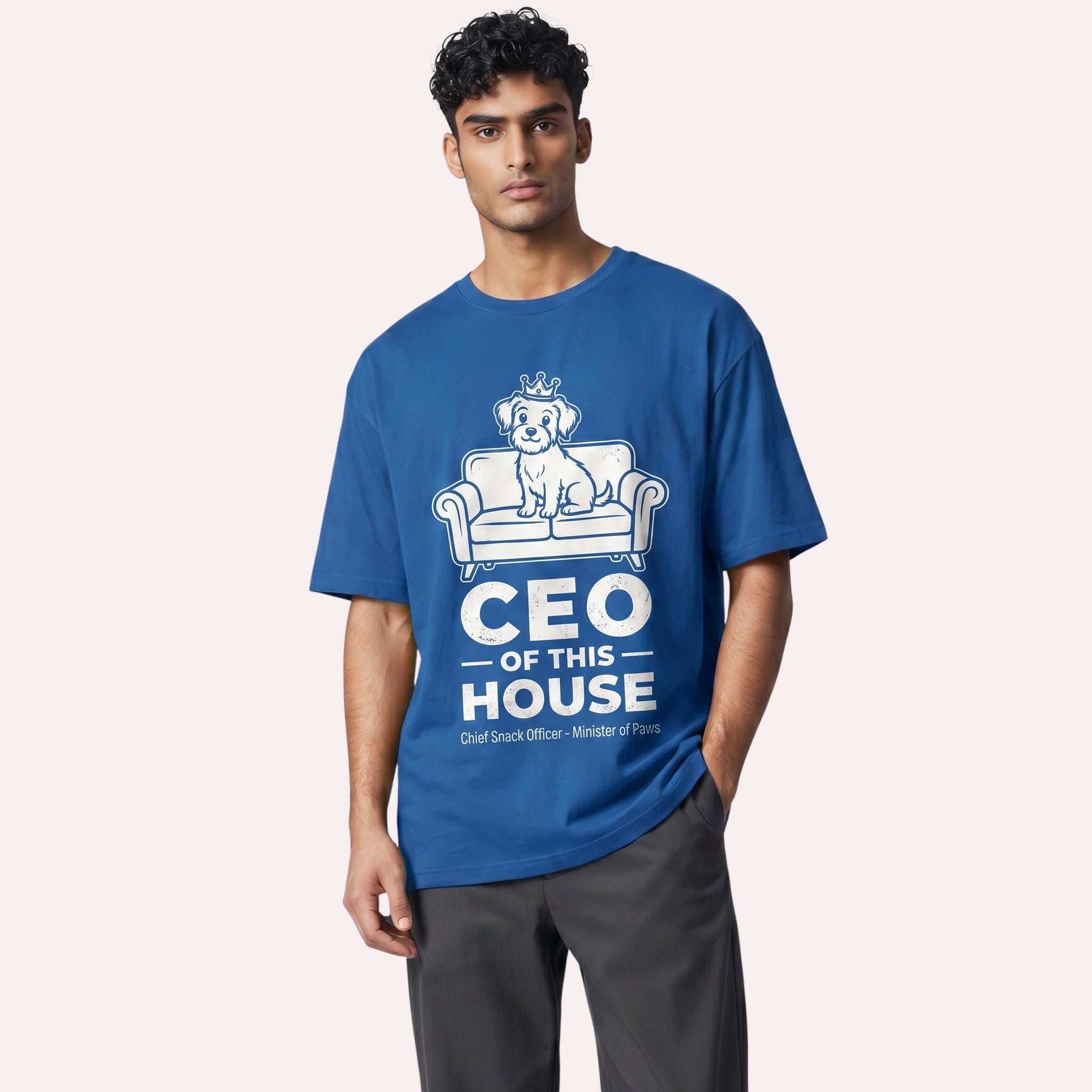 TrendyShift.Com blue cotton unisex t-shirt featuring a graphic of a dog on a couch with CEO of this House text