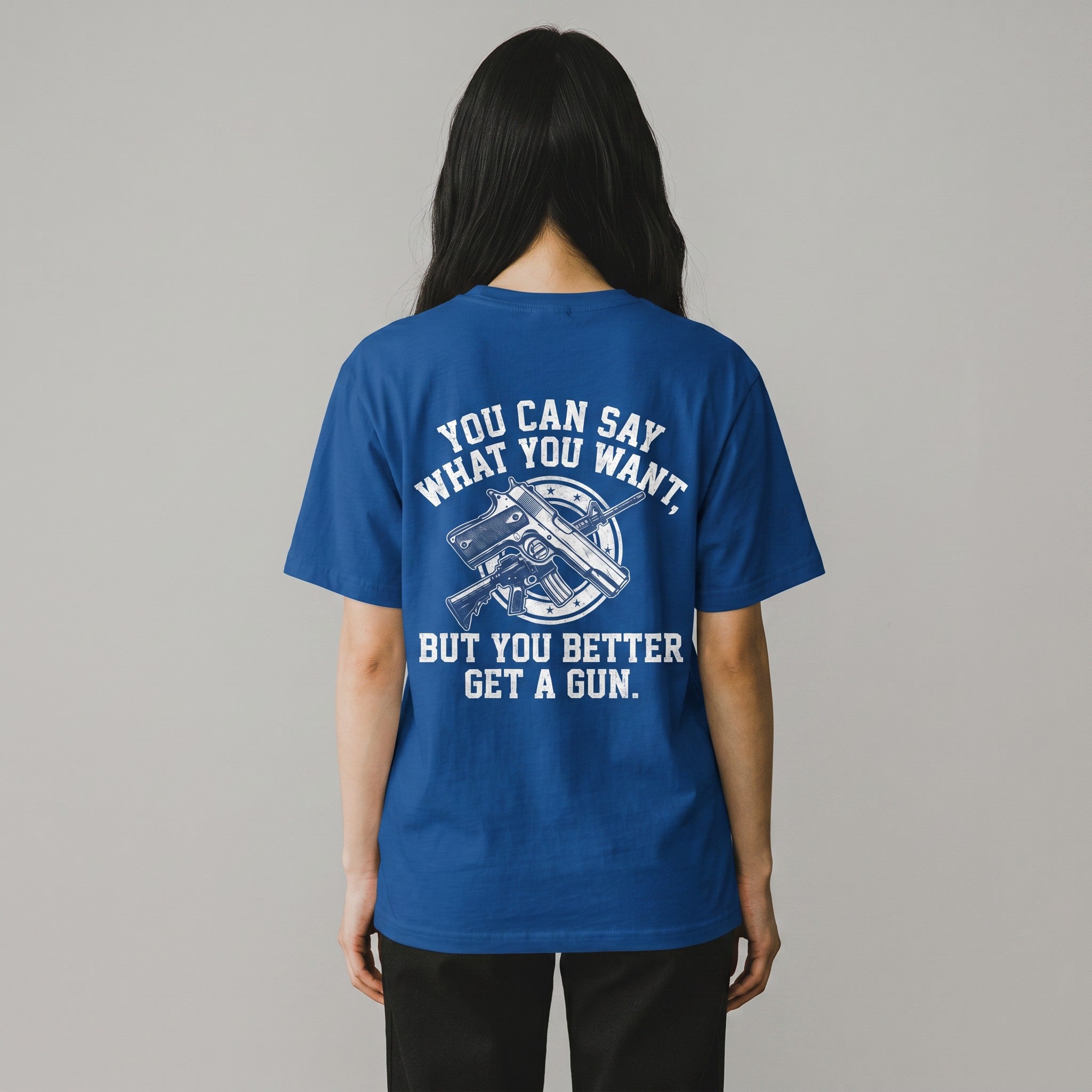 TrendyShift.Com blue cotton t-shirt featuring a white graphic print of a gun and text on the back