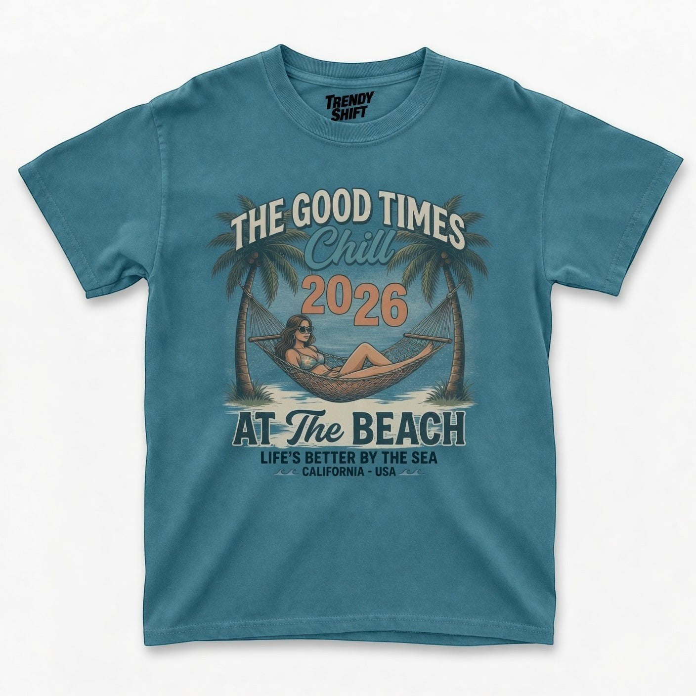 TrendyShift.Com blue graphic t-shirt featuring a retro beach hammock scene with palm trees and summer text.