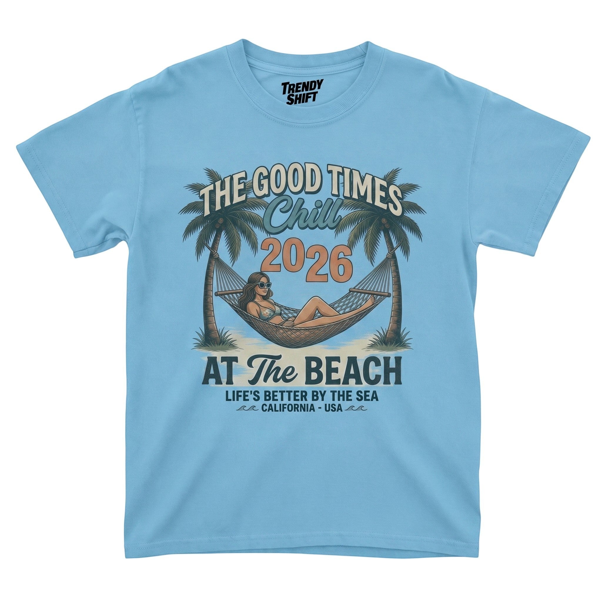 TrendyShift.Com light blue graphic t-shirt featuring a retro beach scene with a woman in a hammock and palm trees.