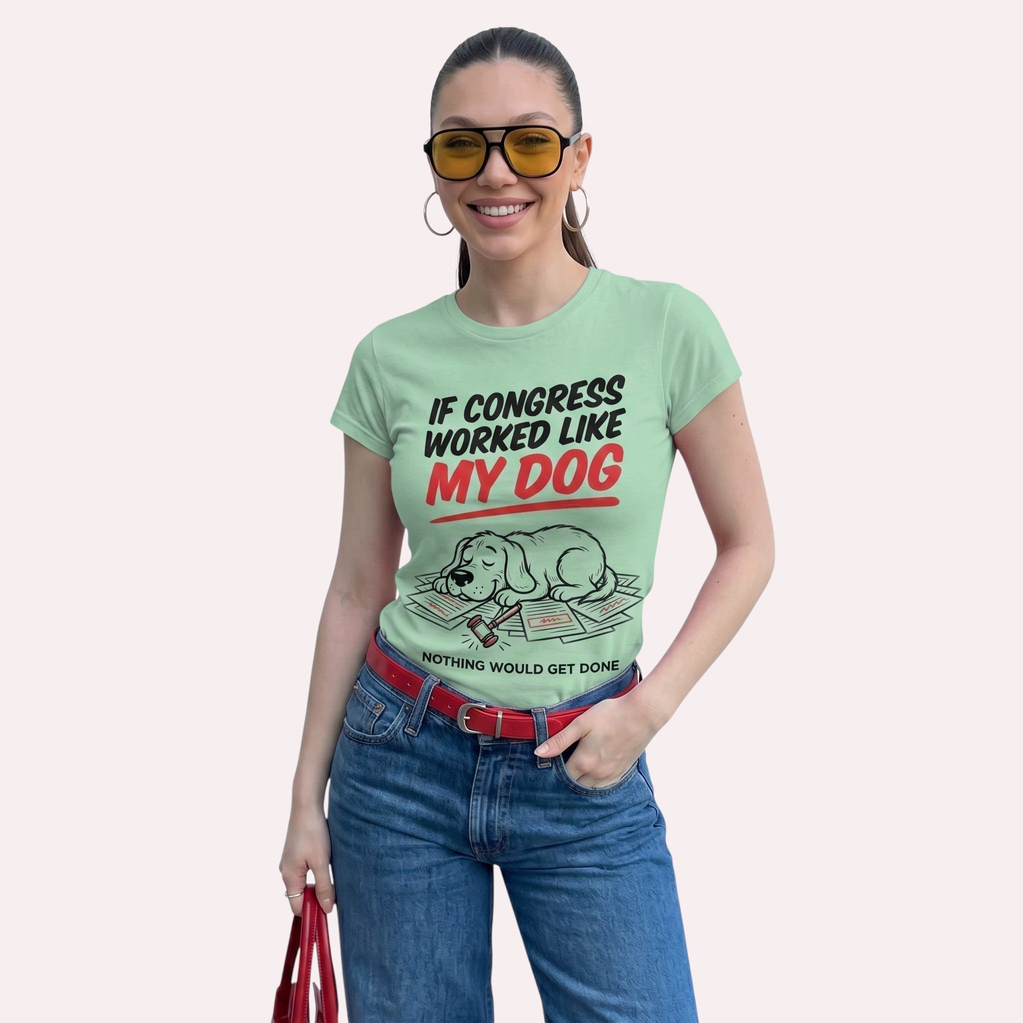 TrendyShift.Com light green graphic t-shirt featuring a sleepy dog and political humor text on a smiling woman.