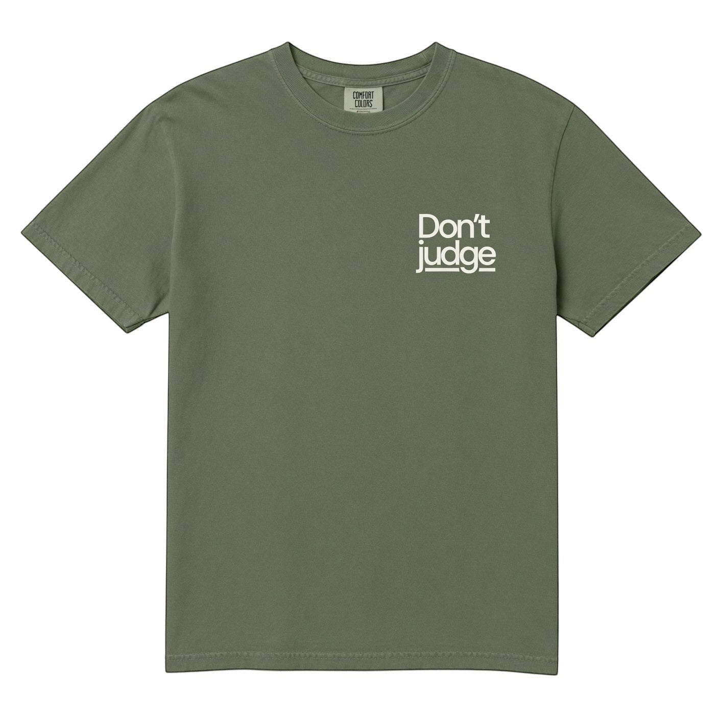 TrendyShift.Com olive green Comfort Colors unisex cotton graphic tee with white Don't Judge chest print