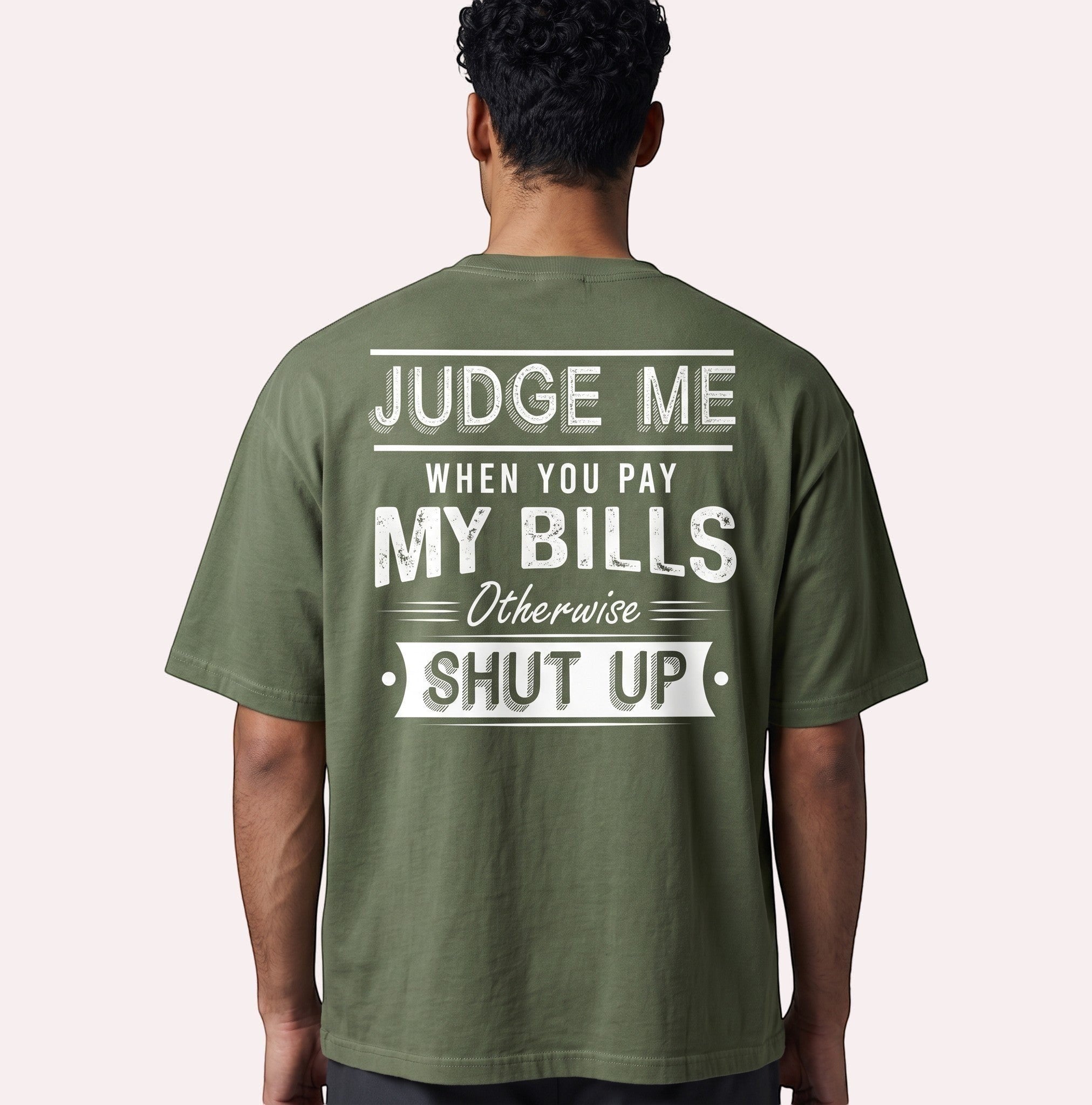 TrendyShift.Com olive green oversized cotton graphic tee with distressed white back print text on a male model