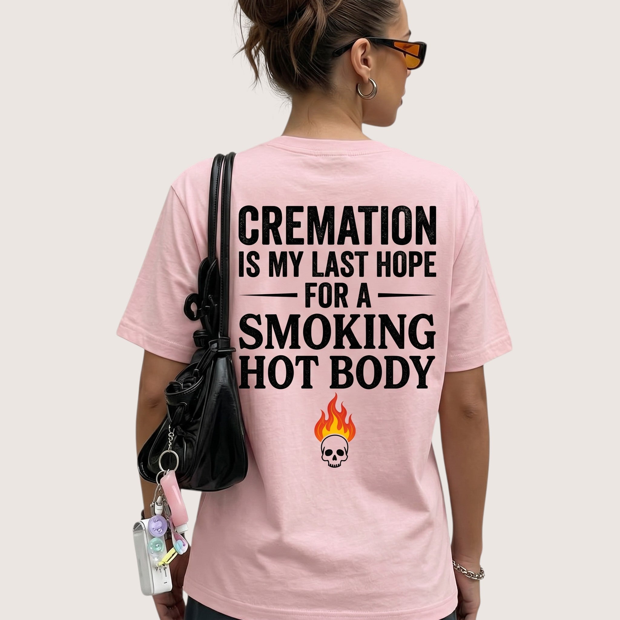TrendyShift.Com light pink unisex t-shirt with back graphic print featuring dark humor quote and skull flame icon