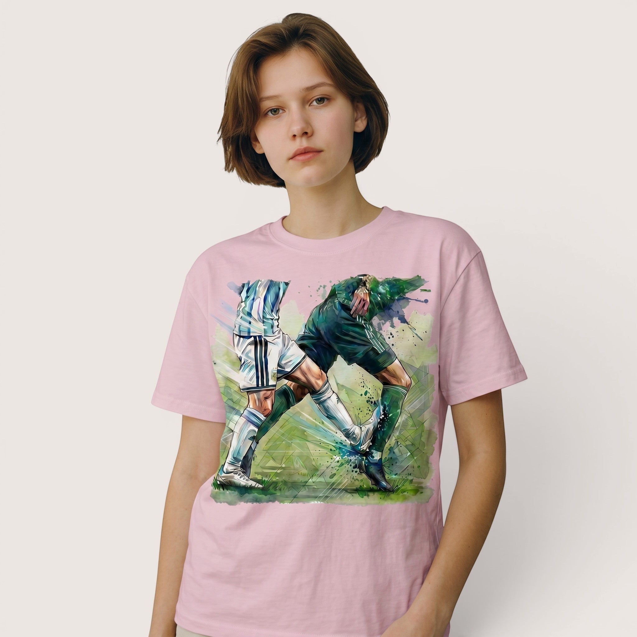 TrendyShift.Com pink cotton t-shirt featuring a dynamic watercolor soccer duel graphic on a young woman
