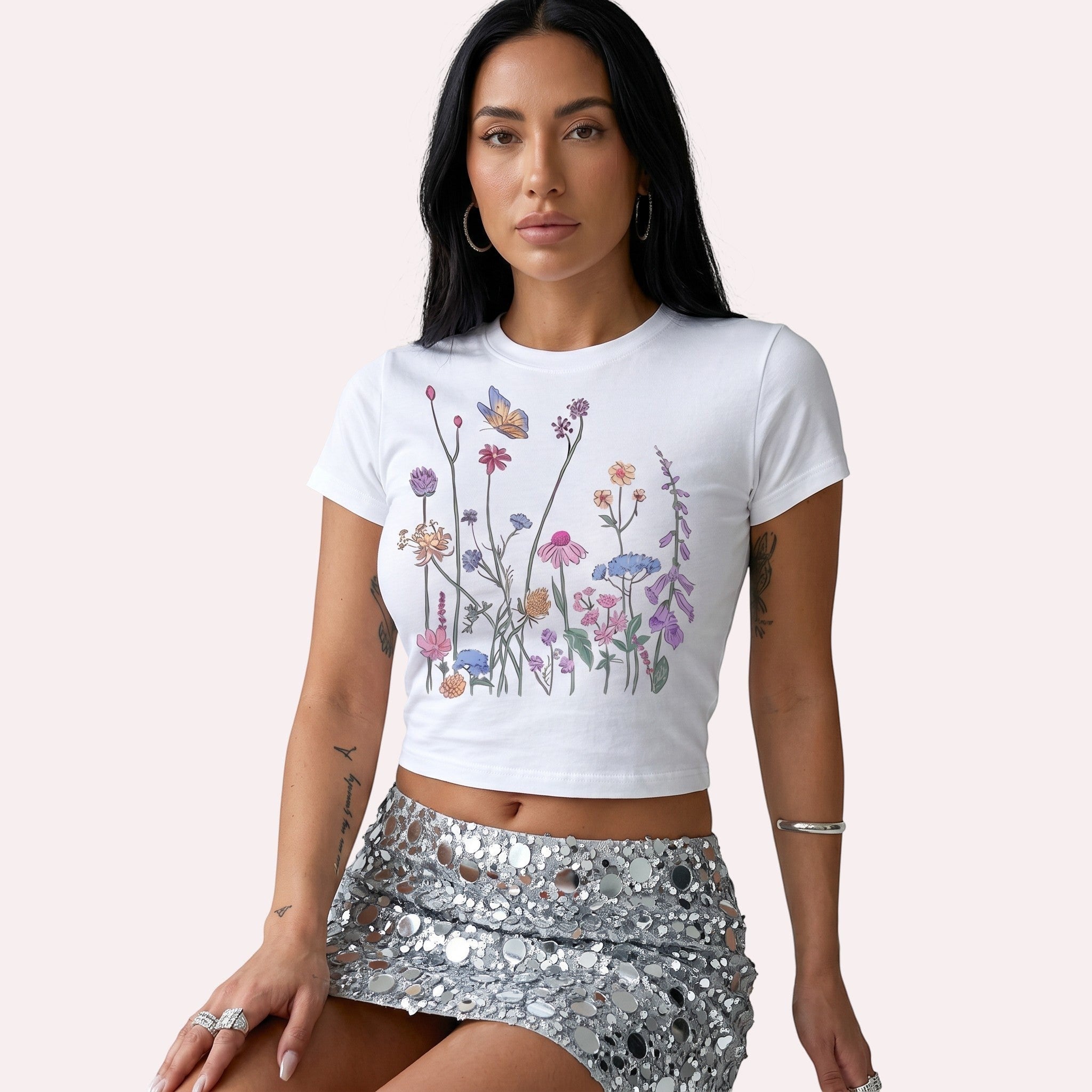 TrendyShift.Com white micro rib crop tee featuring a colorful wildflower and butterfly graphic print.