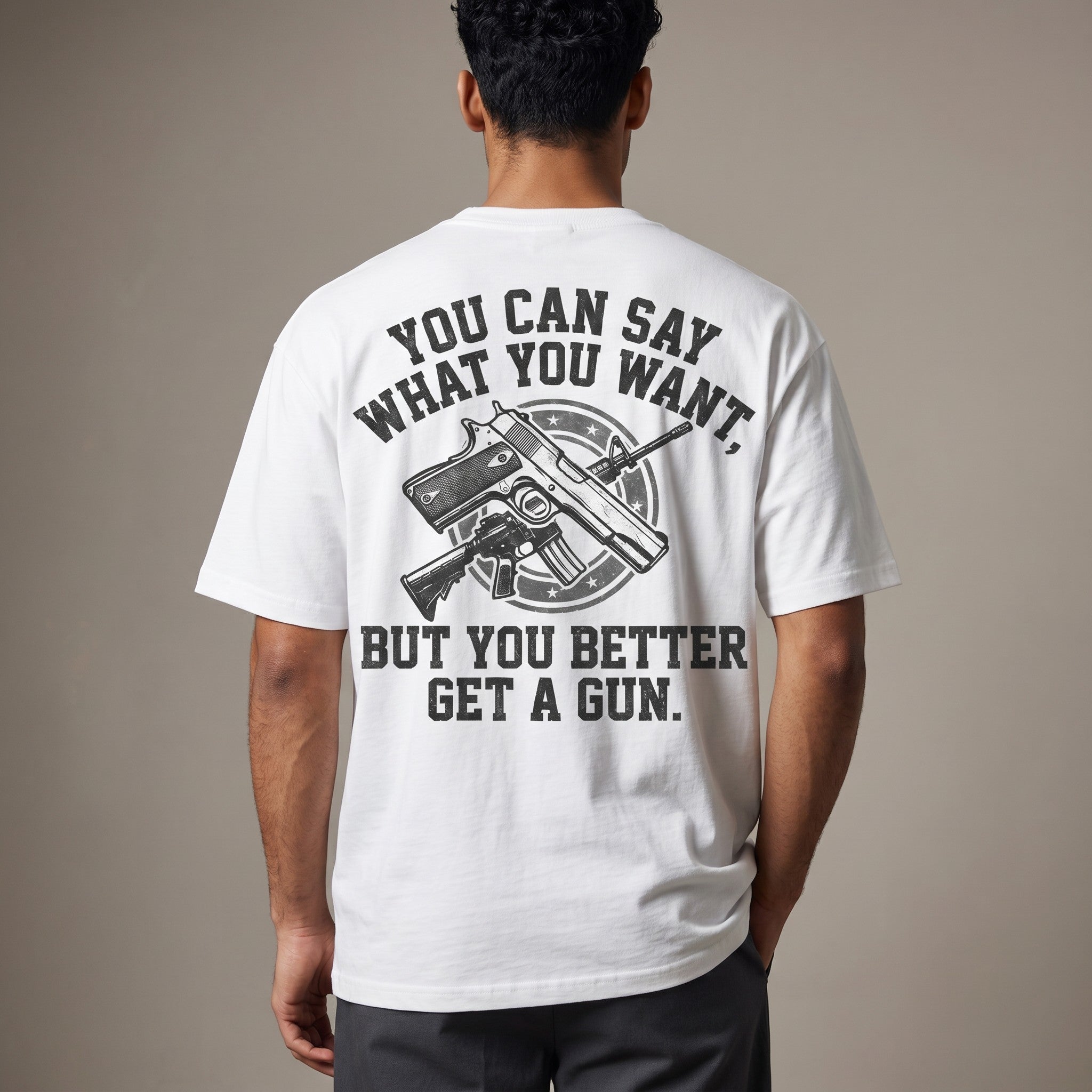 TrendyShift.Com white cotton t-shirt with back graphic print featuring firearms and bold text slogan