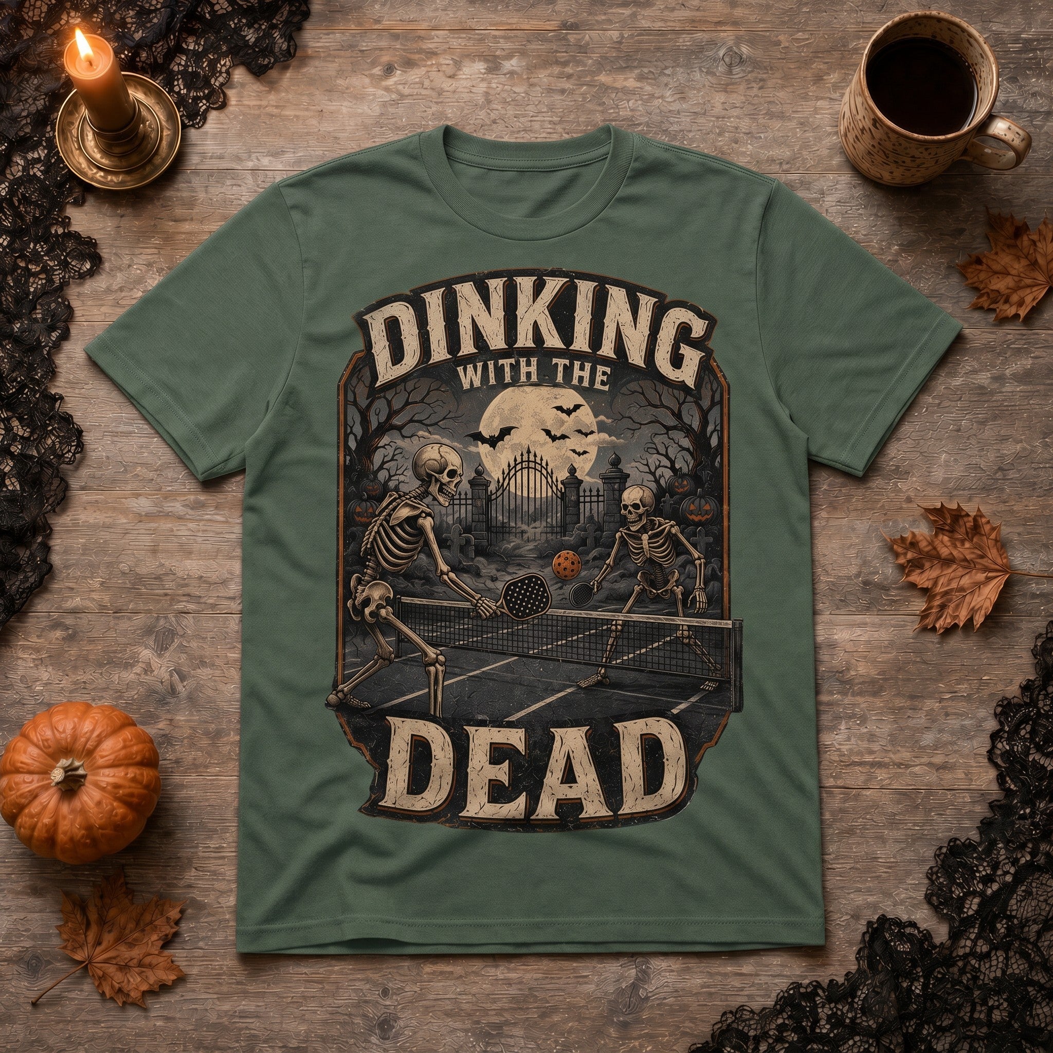 WearTheJoke.com olive green cotton t-shirt featuring a vintage skeleton pickleball graphic for Halloween.